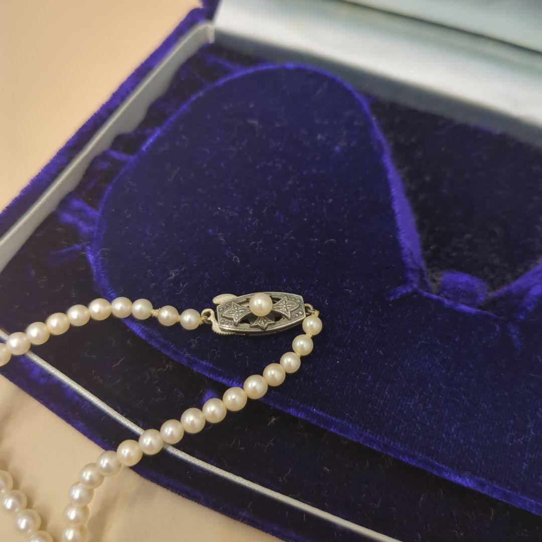 Old Mikimoto genuine pearl necklace with 7mm pearls measuring 38 cm in length