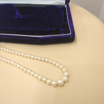 Old Mikimoto genuine pearl necklace with 7mm pearls measuring 38 cm in length