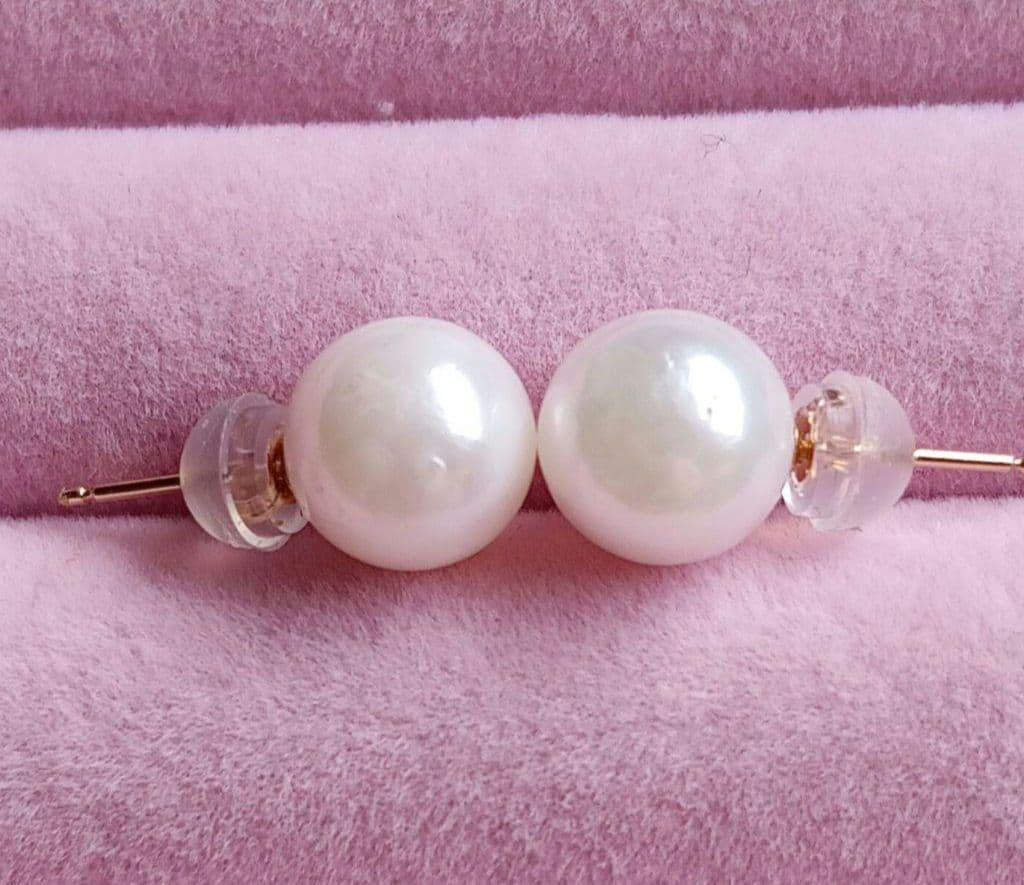 Akoya pearl necklace and matching earrings with 8.5mm round natural white pearls and silver clasp