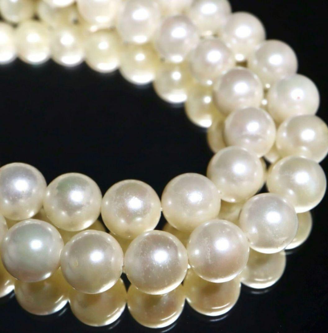 Akoya pearl necklace and matching earrings with 8.5mm round natural white pearls and silver clasp
