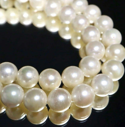 Akoya pearl necklace and matching earrings with 8.5mm round natural white pearls and silver clasp