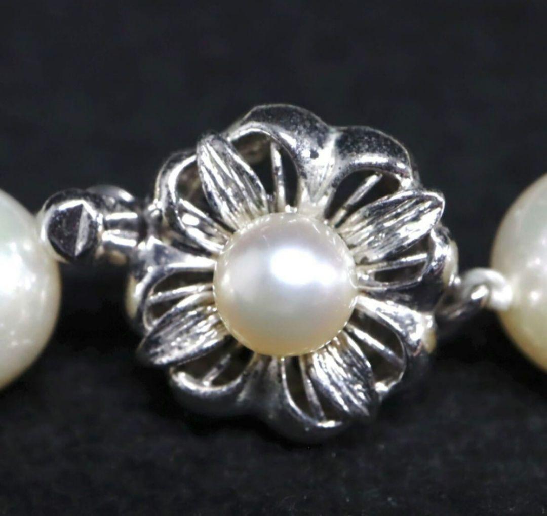 Akoya pearl necklace and matching earrings with 8.5mm round natural white pearls and silver clasp