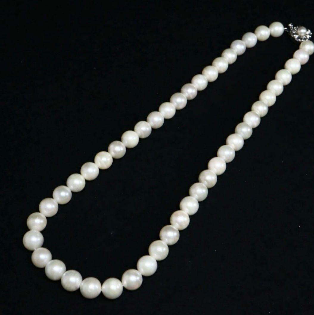 Akoya pearl necklace and matching earrings with 8.5mm round natural white pearls and silver clasp