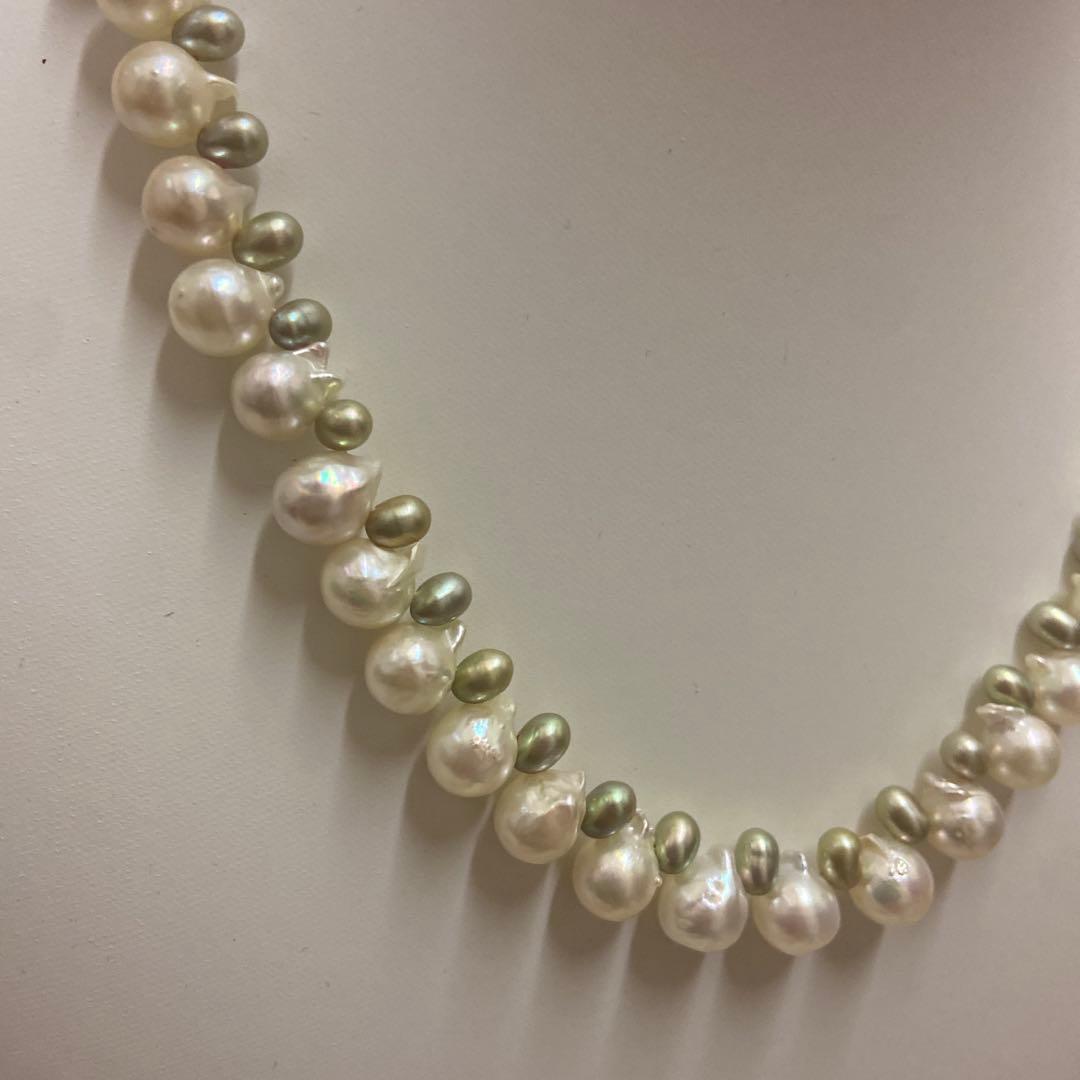 Akoya pearl and green freshwater pearl necklace measuring 45 cm length displayed on white background