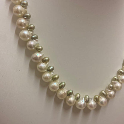 Akoya pearl and green freshwater pearl necklace measuring 45 cm length displayed on white background