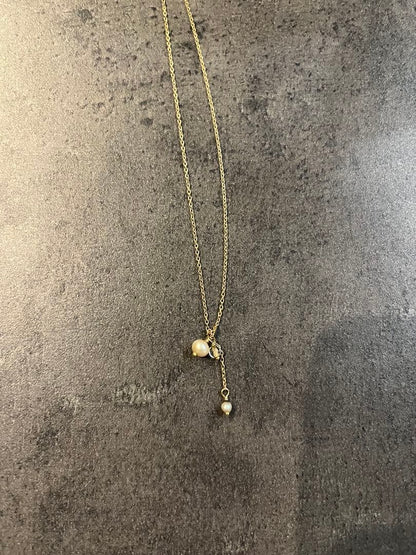 Agete Pearl Necklace in 10k gold with white pearls on a white background showing 38-42cm length