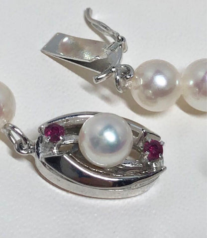 Long Akoya pearl necklace with white round Hanadama pearls measuring 6.0-6.5 mm on K14WG chain