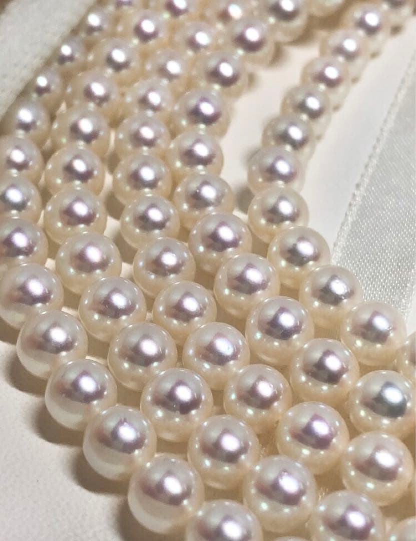 Long Akoya pearl necklace with white round Hanadama pearls measuring 6.0-6.5 mm on K14WG chain
