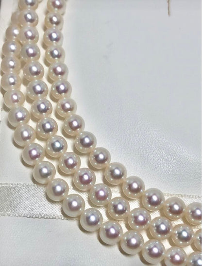 Long Akoya pearl necklace with white round Hanadama pearls measuring 6.0-6.5 mm on K14WG chain