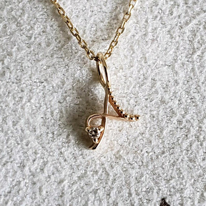 Gold K10 initial necklace with diamond letter A pendant and adjustable chain