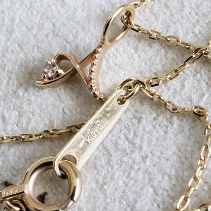 Gold K10 initial necklace with diamond letter A pendant and adjustable chain