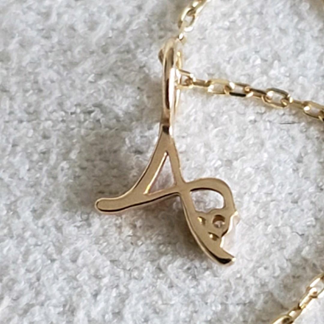 Gold K10 initial necklace with diamond letter A pendant and adjustable chain