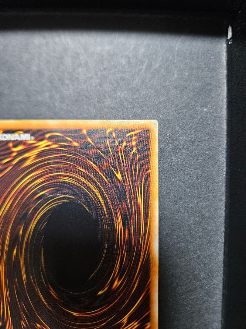 Yu-Gi-Oh Black Magician Leaf Relief card with visible vertical and horizontal folds