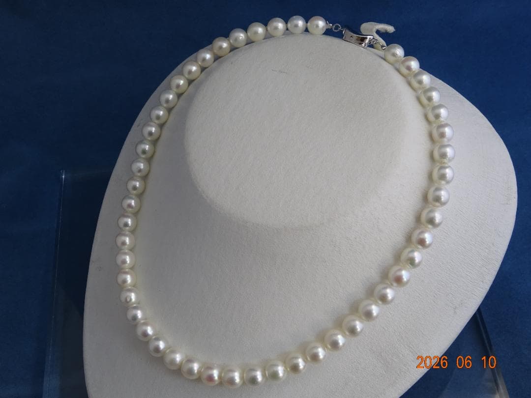 Akoya pearl necklace featuring 8-8.5mm almost round white pearls with pink and cream tones and silver clasp