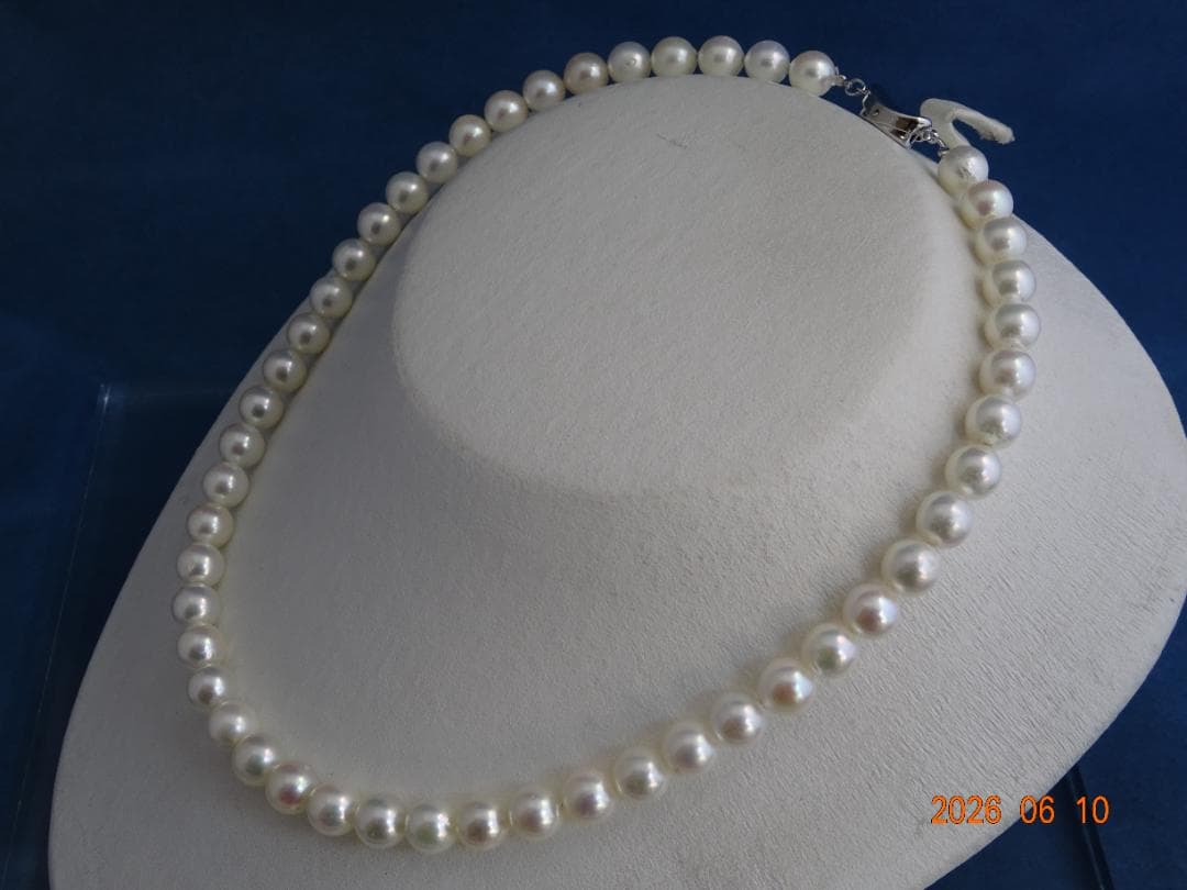Akoya pearl necklace featuring 8-8.5mm almost round white pearls with pink and cream tones and silver clasp