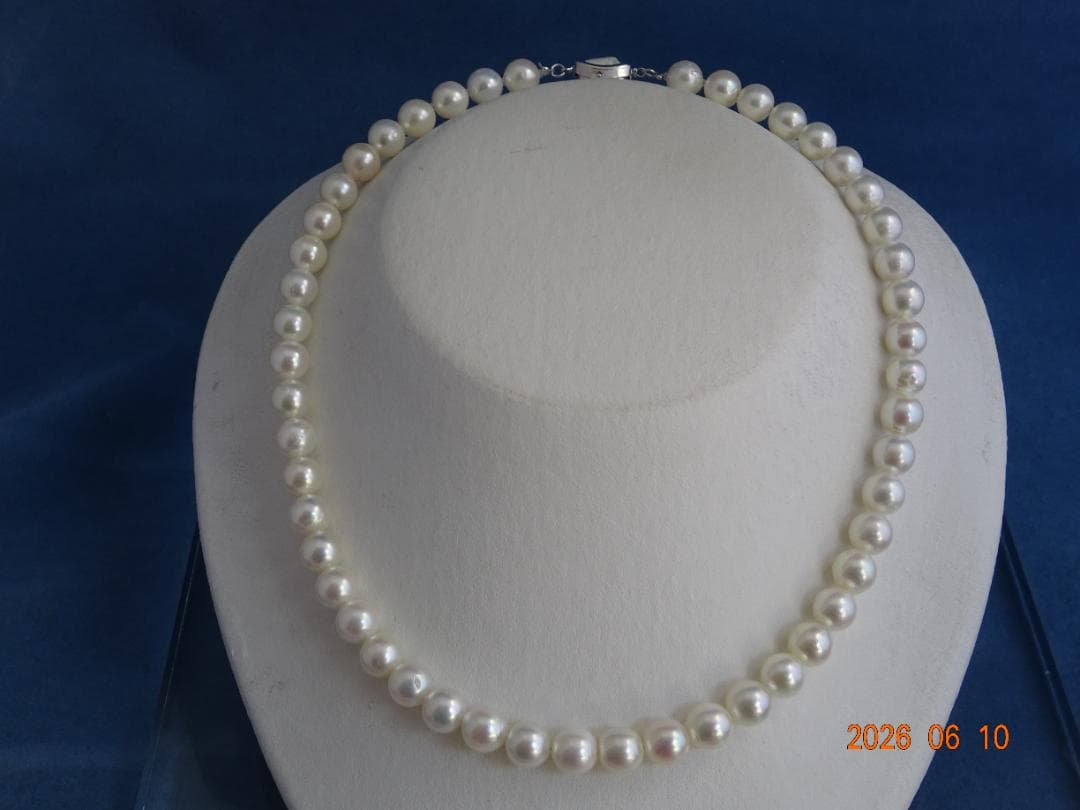 Akoya pearl necklace featuring 8-8.5mm almost round white pearls with pink and cream tones and silver clasp