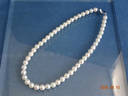 Akoya pearl necklace featuring 8-8.5mm almost round white pearls with pink and cream tones and silver clasp