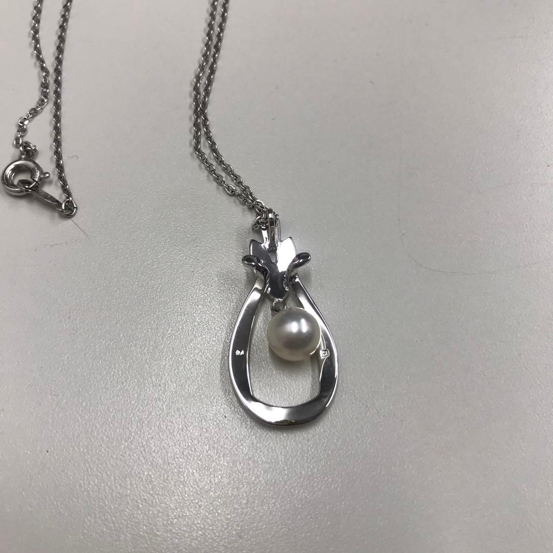 Mikimoto silver pearl necklace featuring 6.8mm round pearls on a silver chain