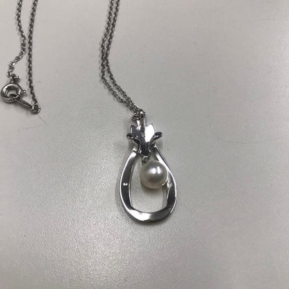 Mikimoto silver pearl necklace featuring 6.8mm round pearls on a silver chain