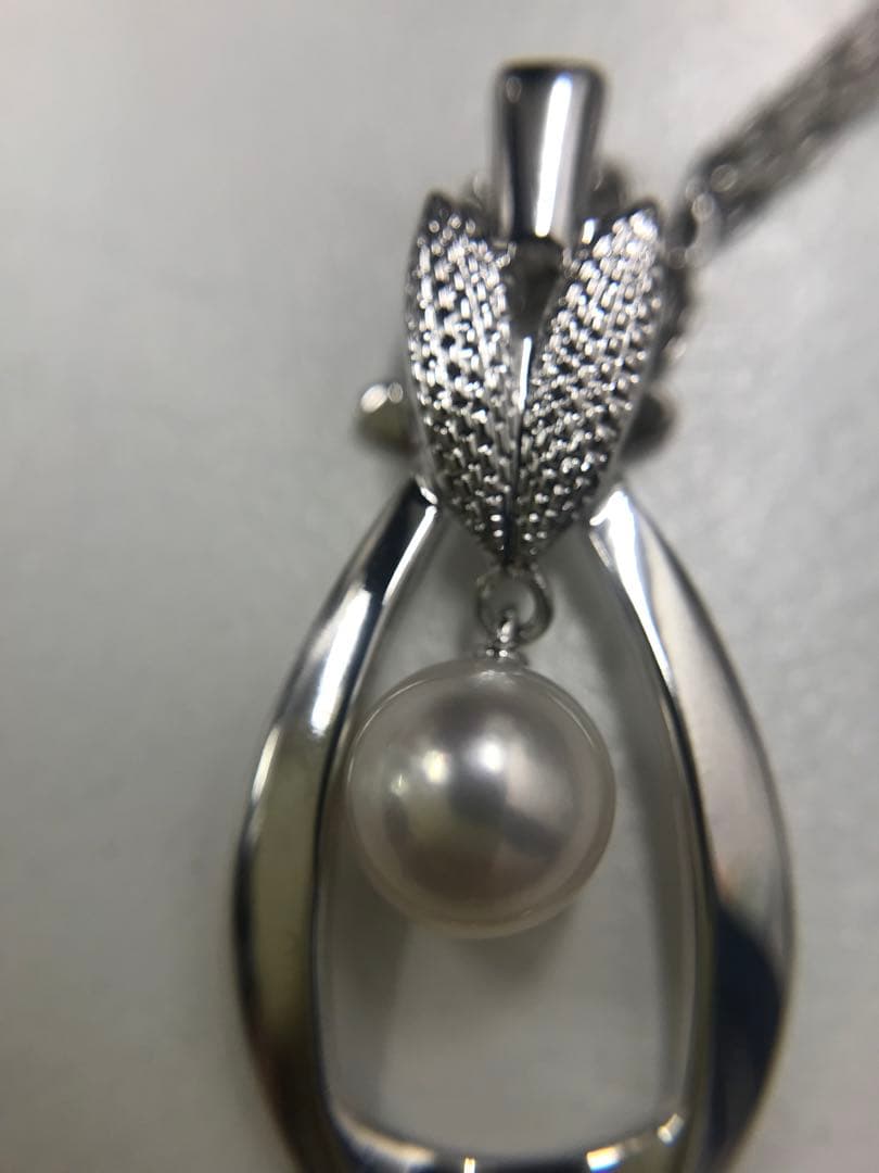 Mikimoto silver pearl necklace featuring 6.8mm round pearls on a silver chain