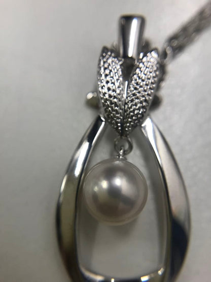 Mikimoto silver pearl necklace featuring 6.8mm round pearls on a silver chain