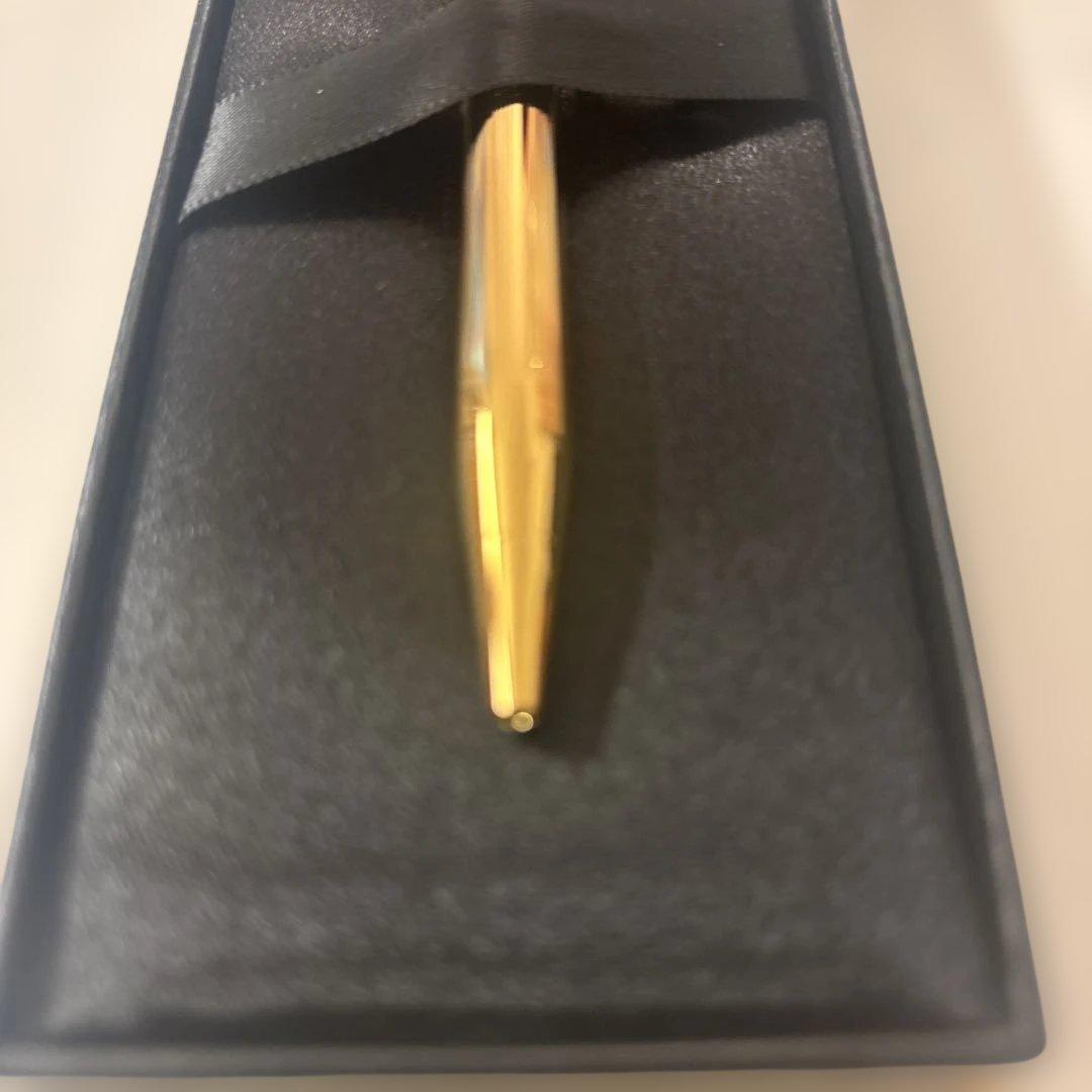 Luxury Card Cross gold ballpoint pen with LC logo on a white background