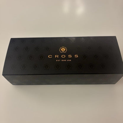 Luxury Card Cross gold ballpoint pen with LC logo on a white background