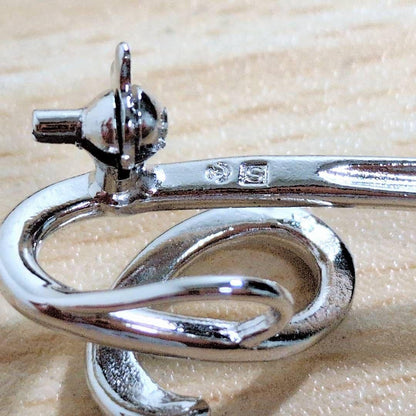 Tasaki silver necklace with 7.5mm pearl and matching brooch on white background