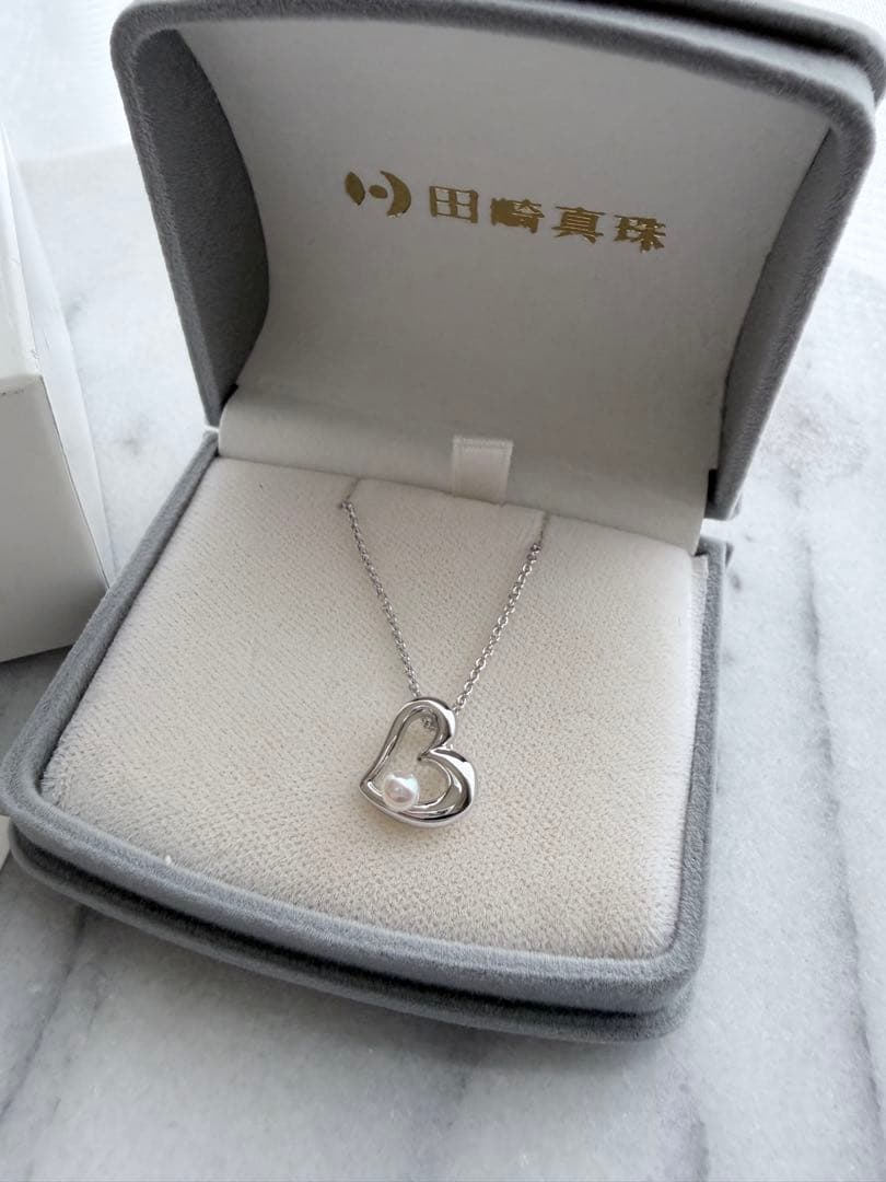 TASAKI Pearl Heart Pendant made of Silver925 with 3.5mm pearl on a white background