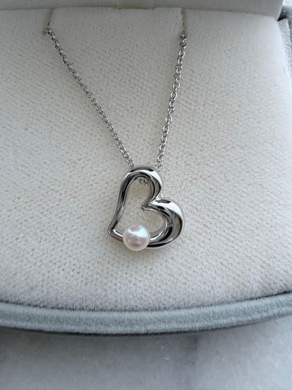 TASAKI Pearl Heart Pendant made of Silver925 with 3.5mm pearl on a white background