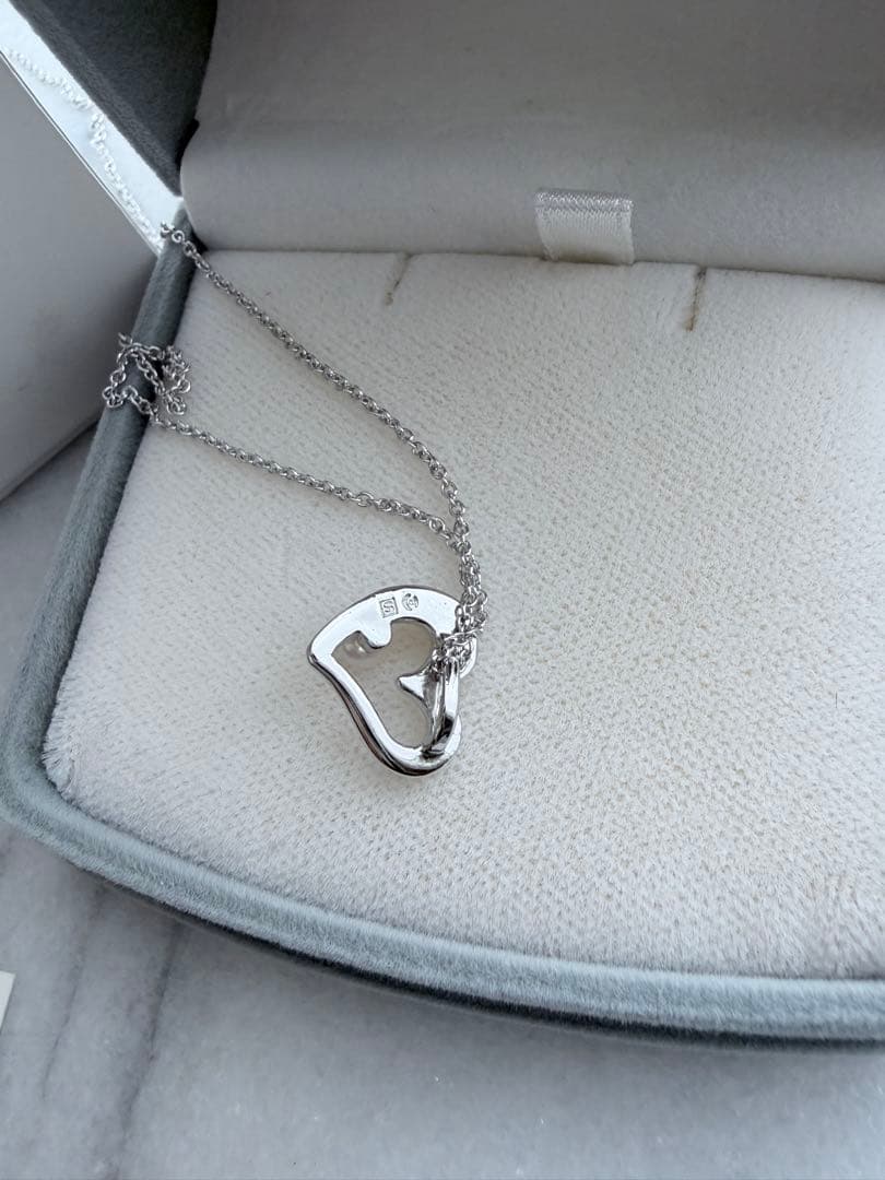 TASAKI Pearl Heart Pendant made of Silver925 with 3.5mm pearl on a white background
