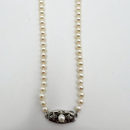 MIKIMOTO pearl necklace with white 7mm pearls and silver fittings, classic design, used condition