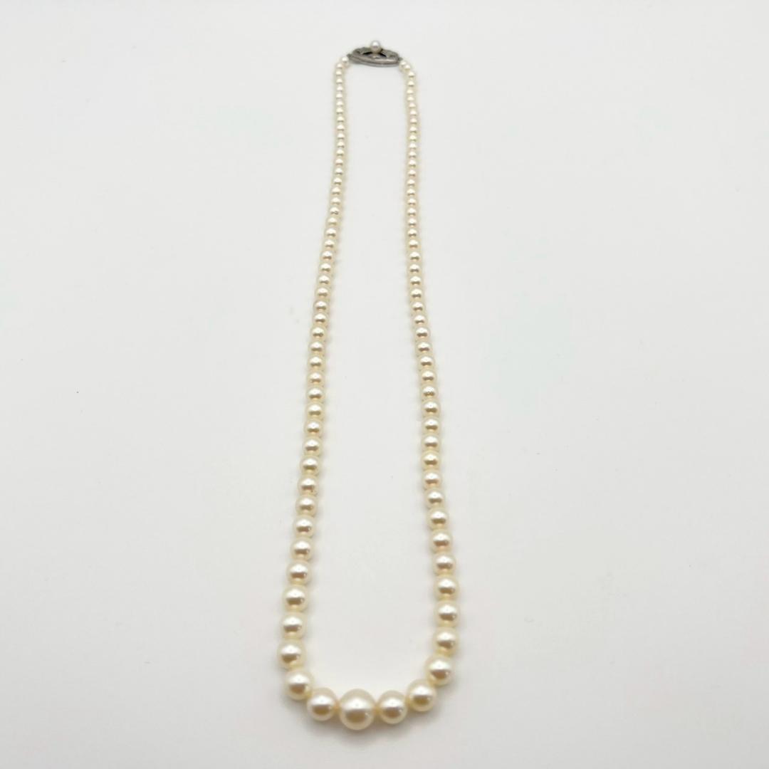 MIKIMOTO pearl necklace with white 7mm pearls and silver fittings, classic design, used condition