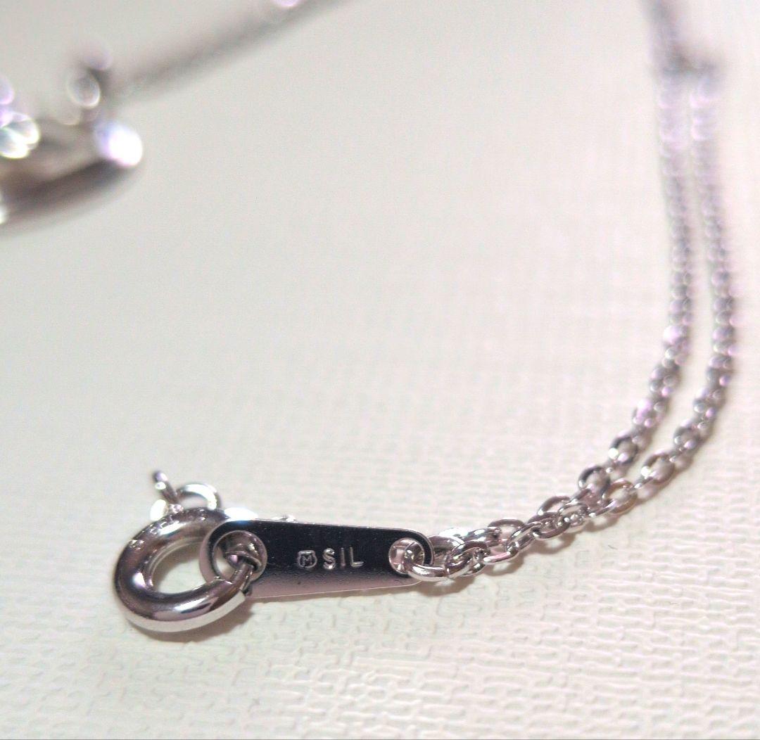 Mikimoto Pearl Heart Necklace featuring a silver heart pendant with a single pearl