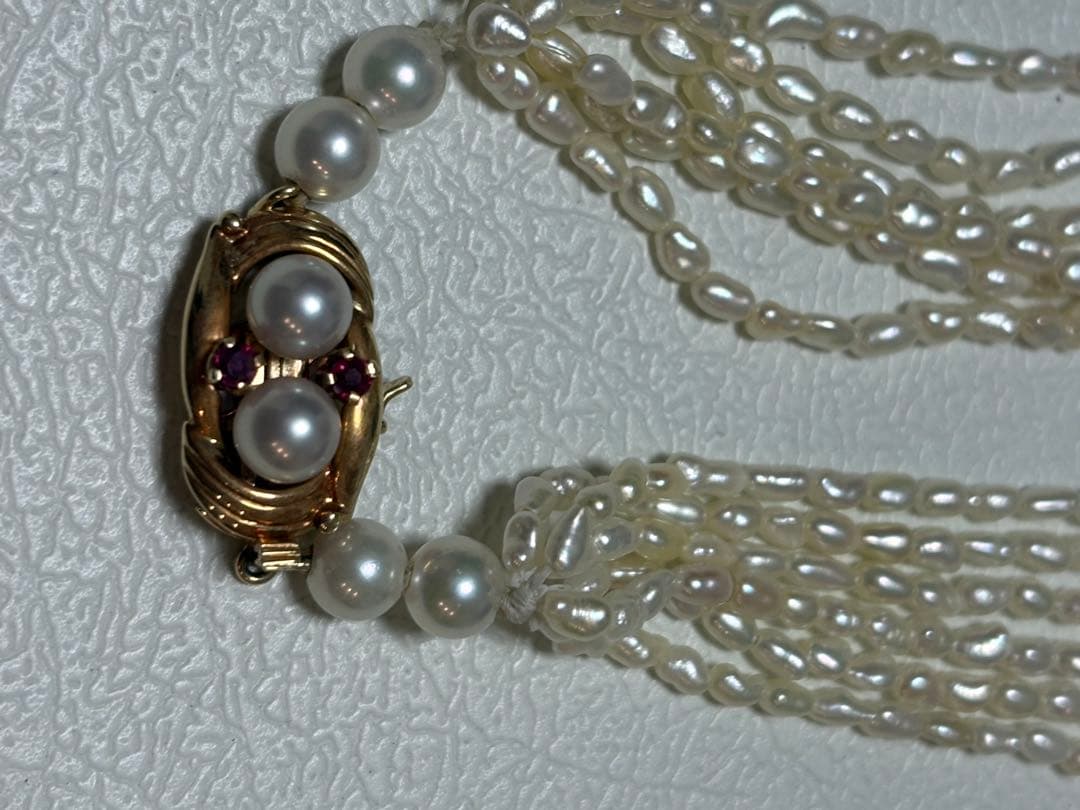 14k Akoya Keshi pearl necklace with ruby clasp 60cm displayed on white background