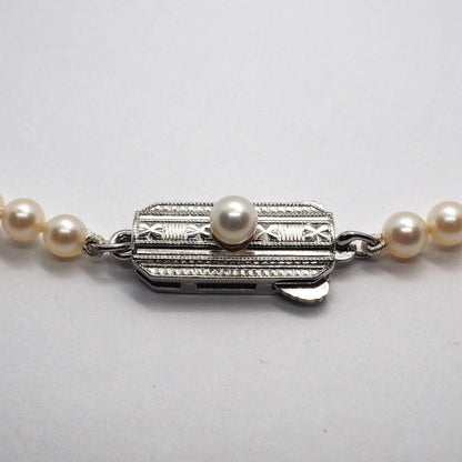 Mikimoto pearl necklace with 98 pearls on silver chain measuring 44.5 cm