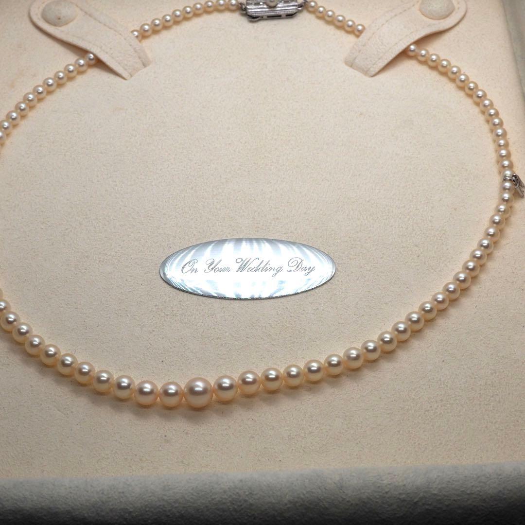 Mikimoto pearl necklace with 98 pearls on silver chain measuring 44.5 cm