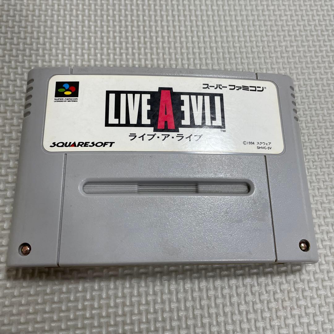 Super Famicom Live A Live game cartridge with box, manual, and plastic case showing visible discoloration on the back