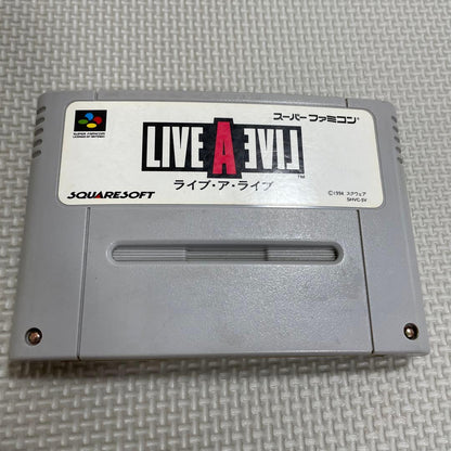 Super Famicom Live A Live game cartridge with box, manual, and plastic case showing visible discoloration on the back