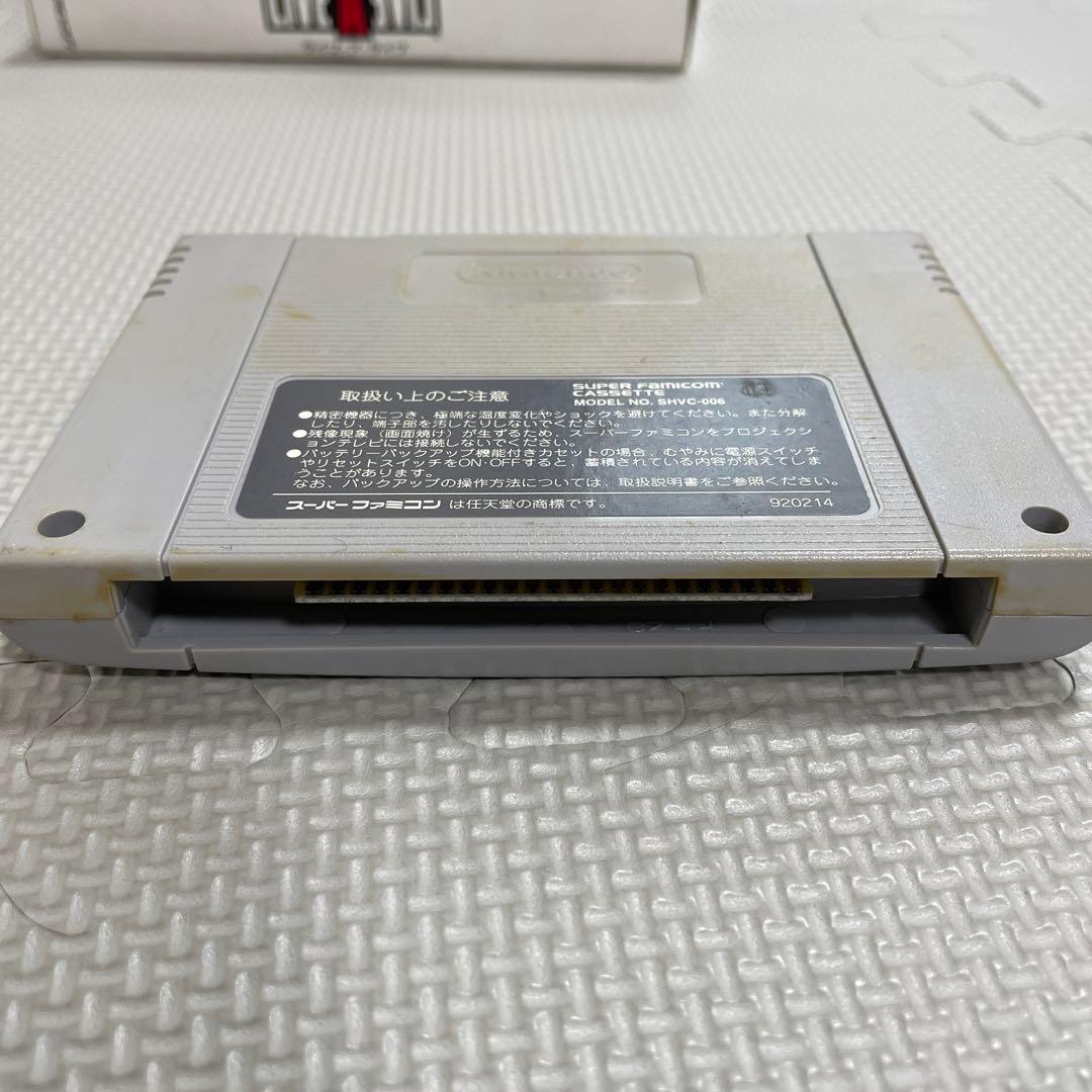 Super Famicom Live A Live game cartridge with box, manual, and plastic case showing visible discoloration on the back