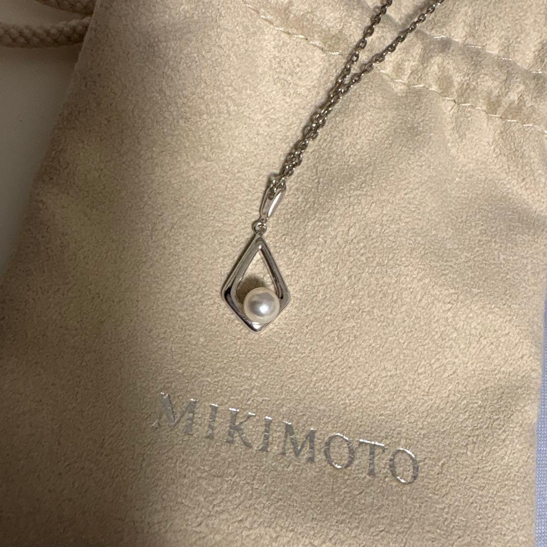 Mikimoto Pearl Necklace with silver chain and pearl pendant displayed with box and dedicated bag
