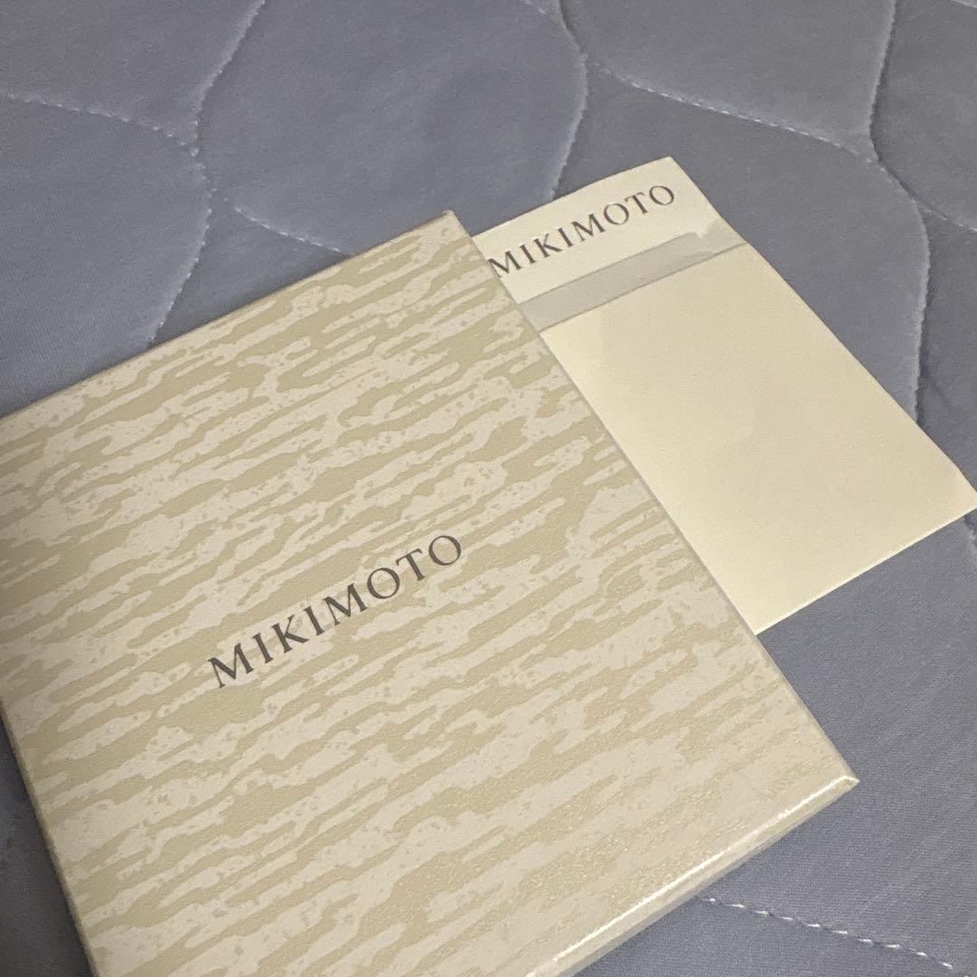 Mikimoto Pearl Necklace with silver chain and pearl pendant displayed with box and dedicated bag