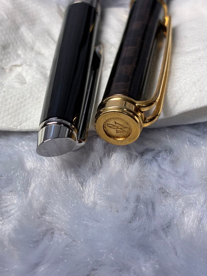 Set of 2 used Waterman fountain pens with gold accents shown side by side