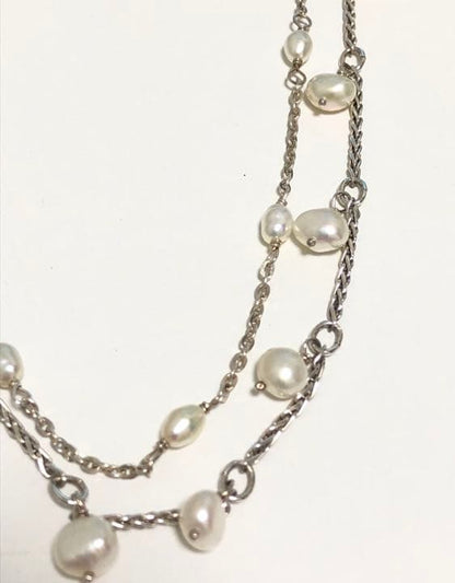Akat necklace featuring two strands of varied size freshwater pearls on a 40 cm silver chain