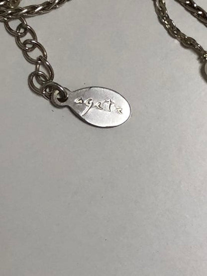 Akat necklace featuring two strands of varied size freshwater pearls on a 40 cm silver chain