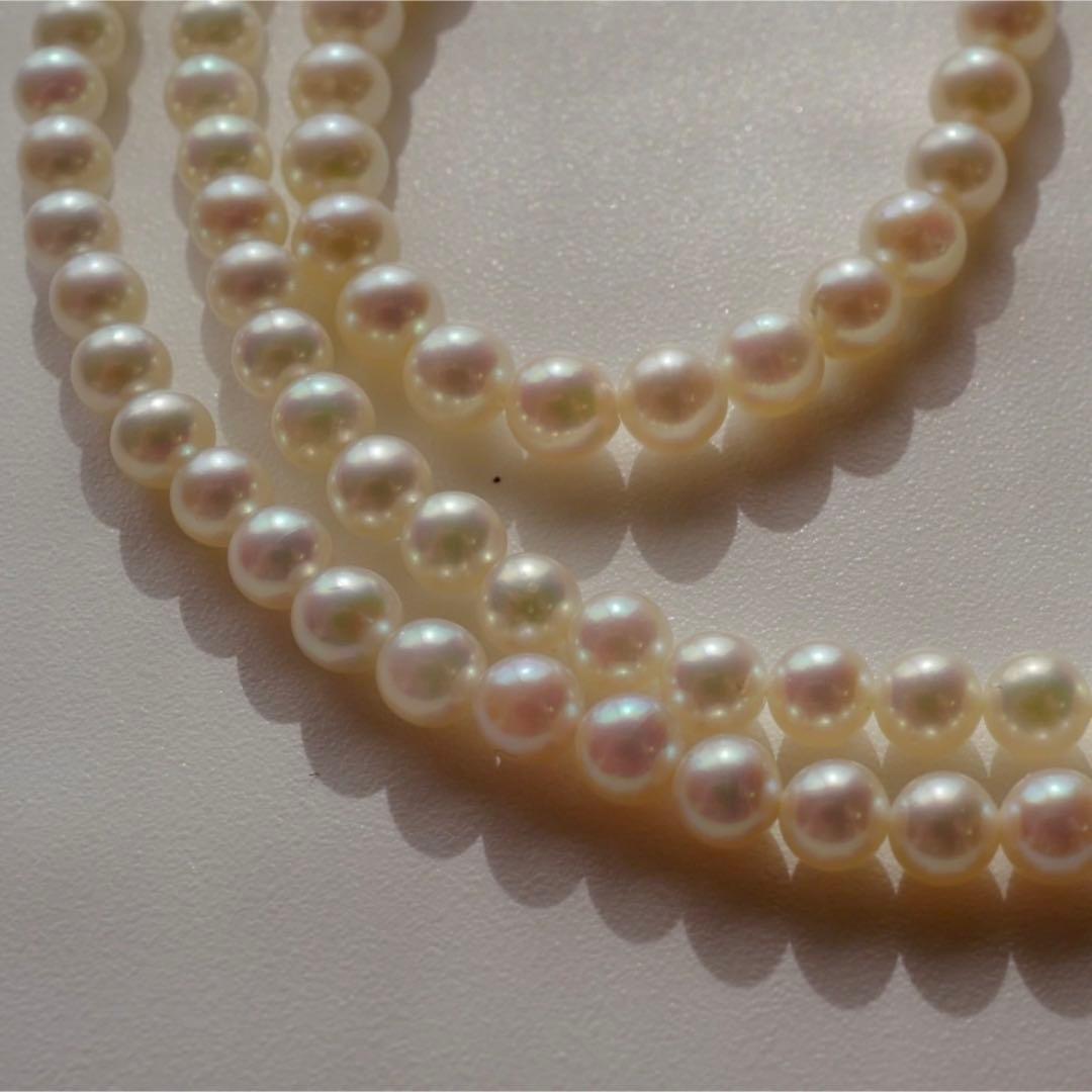 New Akoya pearls genuine baby long necklace 80.5cm with 5.0-4.0mm white pink pearls and silver fittings on display