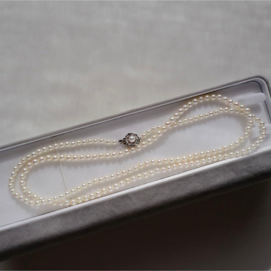 New Akoya pearls genuine baby long necklace 80.5cm with 5.0-4.0mm white pink pearls and silver fittings on display
