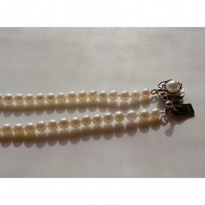 New Akoya pearls genuine baby long necklace 80.5cm with 5.0-4.0mm white pink pearls and silver fittings on display