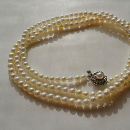 New Akoya pearls genuine baby long necklace 80.5cm with 5.0-4.0mm white pink pearls and silver fittings on display