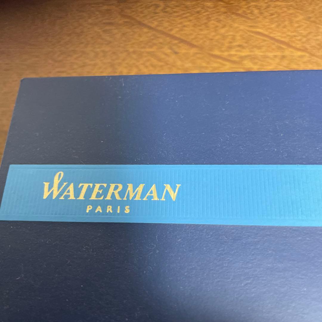 WATERMAN Ballpoint Pen with matte black body and silver trim next to a matching dedicated case